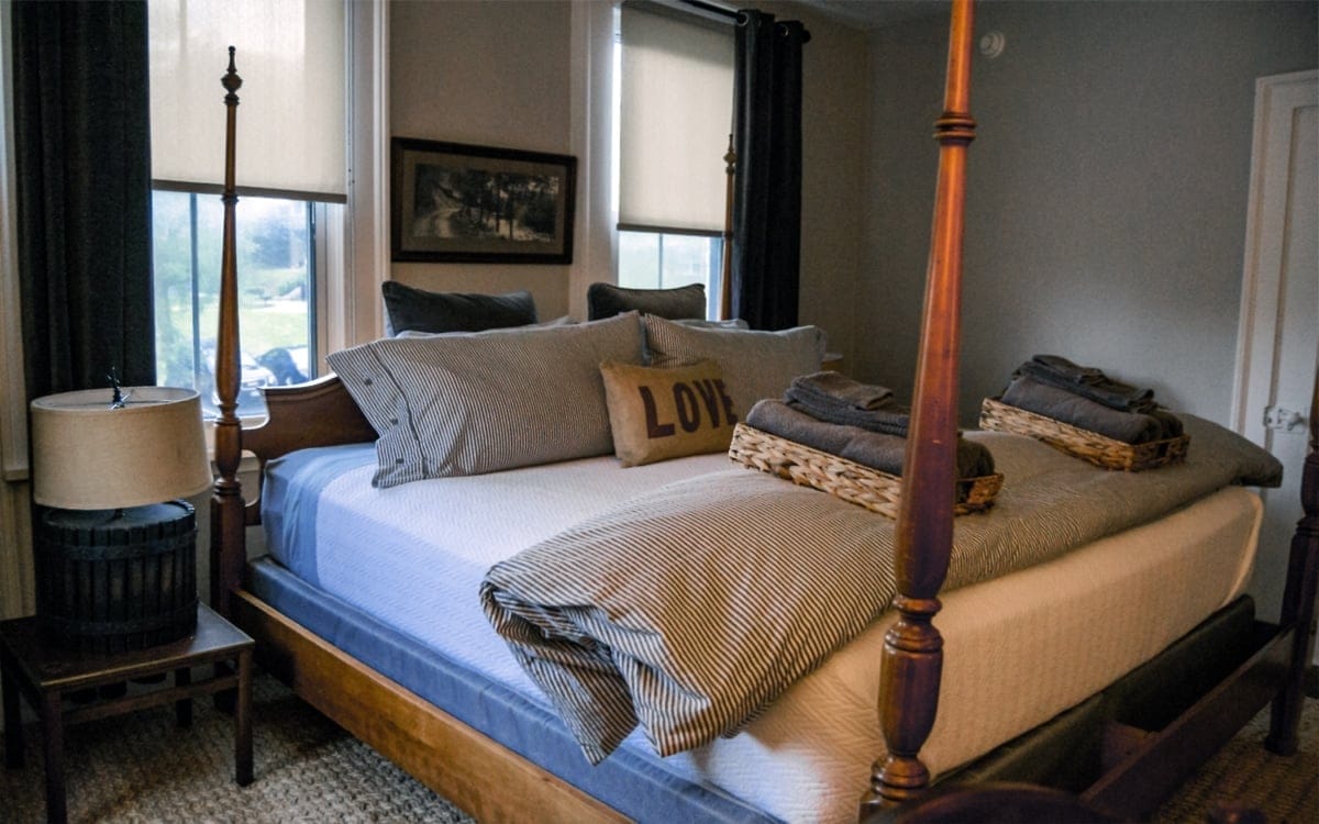The Pennington's cozy corner room with a king bed, located on the second floor, just above the dining room at Wm. Farmer & Sons. | Photo by Andrew Frey
