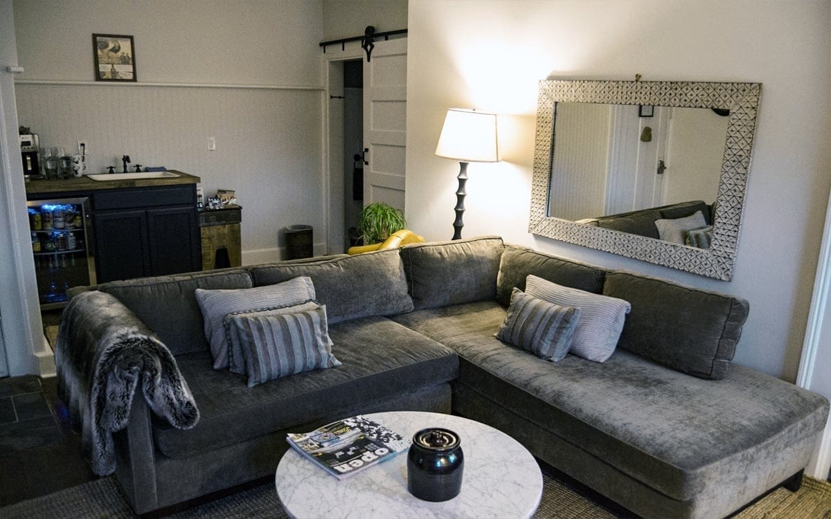 The Pennington, a two-bedroom suite, sandwiching a darling living room and cozy kitchen, is named for owner and chef Kirby’s maternal grandfather, Paul Pennington Hearn. | Photo by Andrew Frey