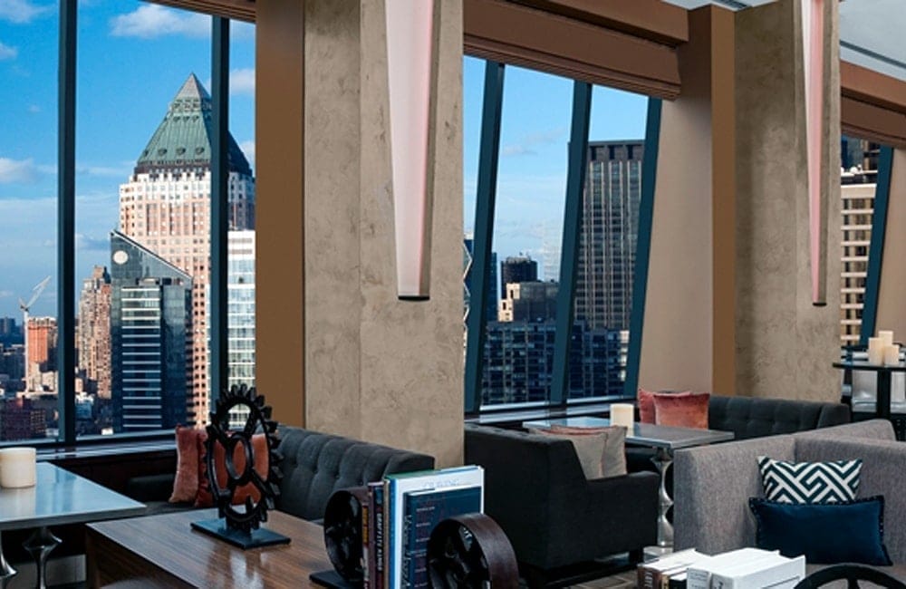 The lobby at Hilton Times Square overlooking New York City's skyline. | Photo from Hilton Times Square