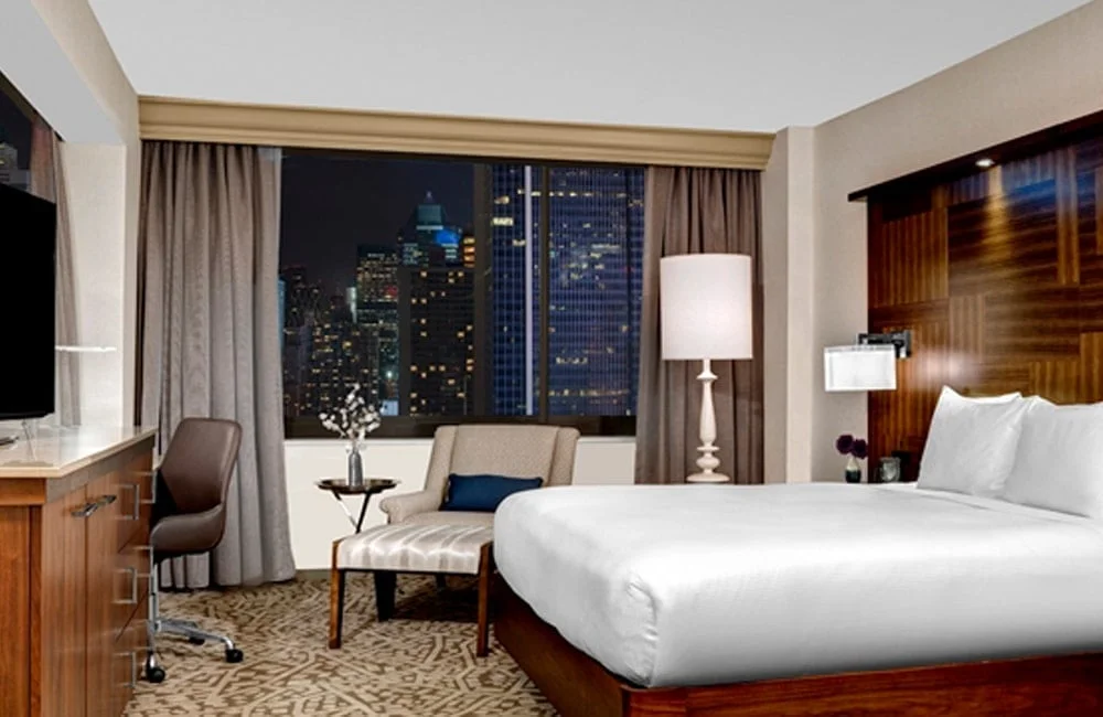 One of the 478 oversized guest rooms at Hilton Times Square—complete with high-end amenities and an amazing view. | Photo from Hilton Times Square