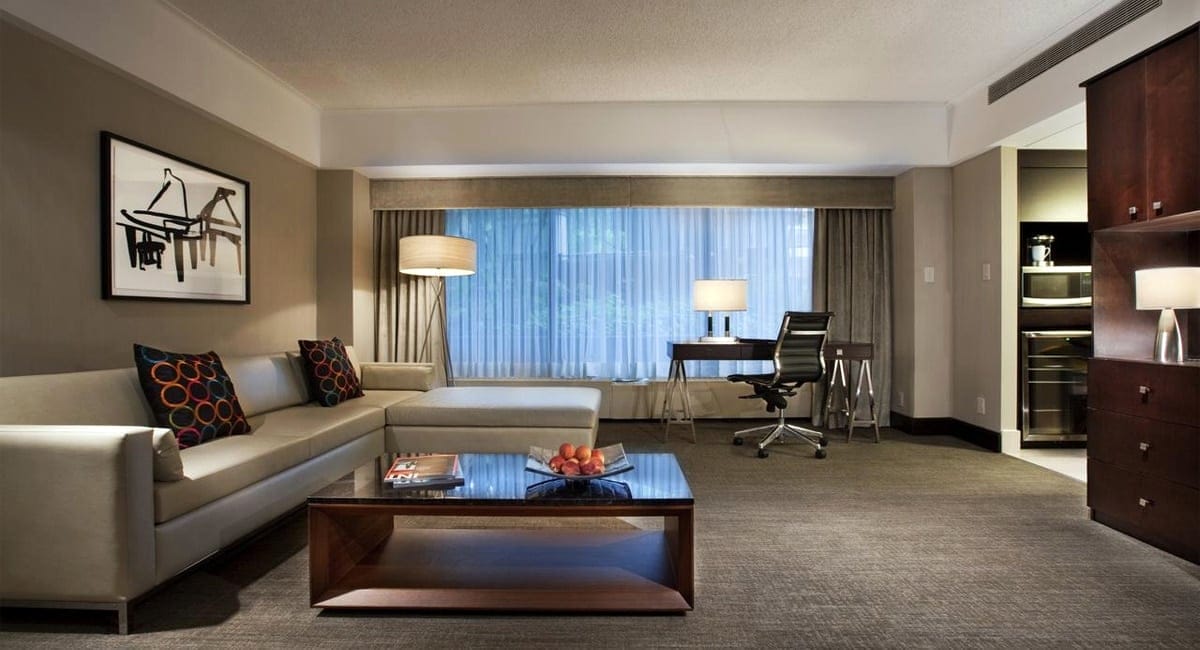 A comfortable, modern living room setting in one of the hotel's suites. | Photo from Hotel Bonaventure Montréal