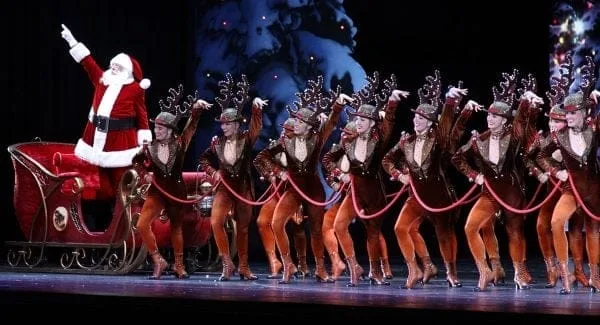 Santa Claus and The Rockettes line the stage at Radio City Music Hall. | Photo from Radio City Christmas Spectacular