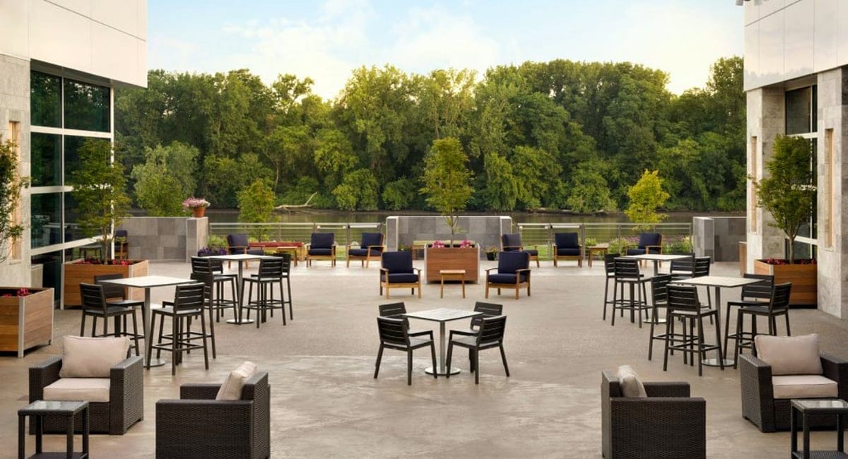 Enjoy an afternoon on the patio overlooking the new Mohawk Harbor. | Photo from the Landing Hotel