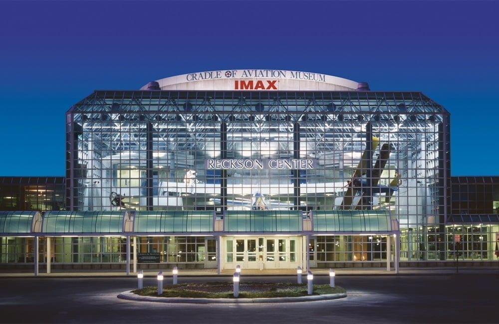 The gorgeous, glass exterior Reckson Center in Garden City, NY at night. | Photo from Cradle of Aviation Museum