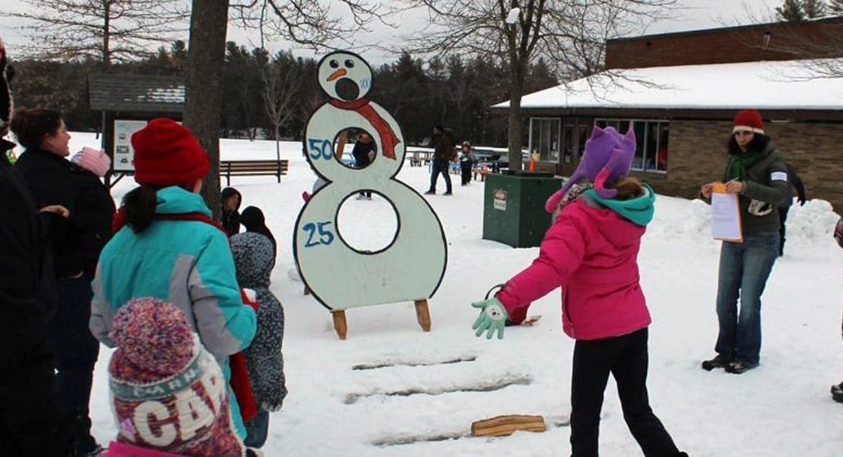 Kids enjoying a game of snowman beanbag toss | Photo from Winter Fest at Grafton State Park