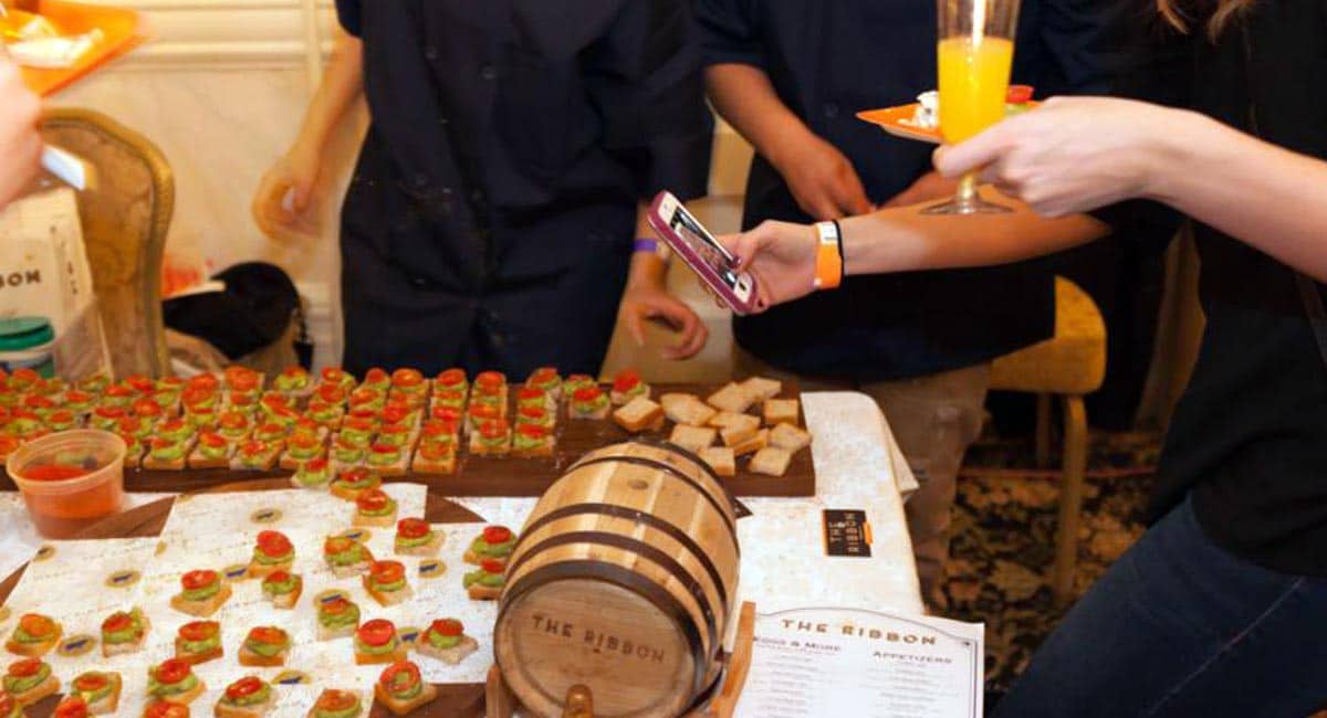 A Guest Snaps a Photo of the Tasty Treats at BrunchCon NYC | Photo from Brandon Hardin-Metro US