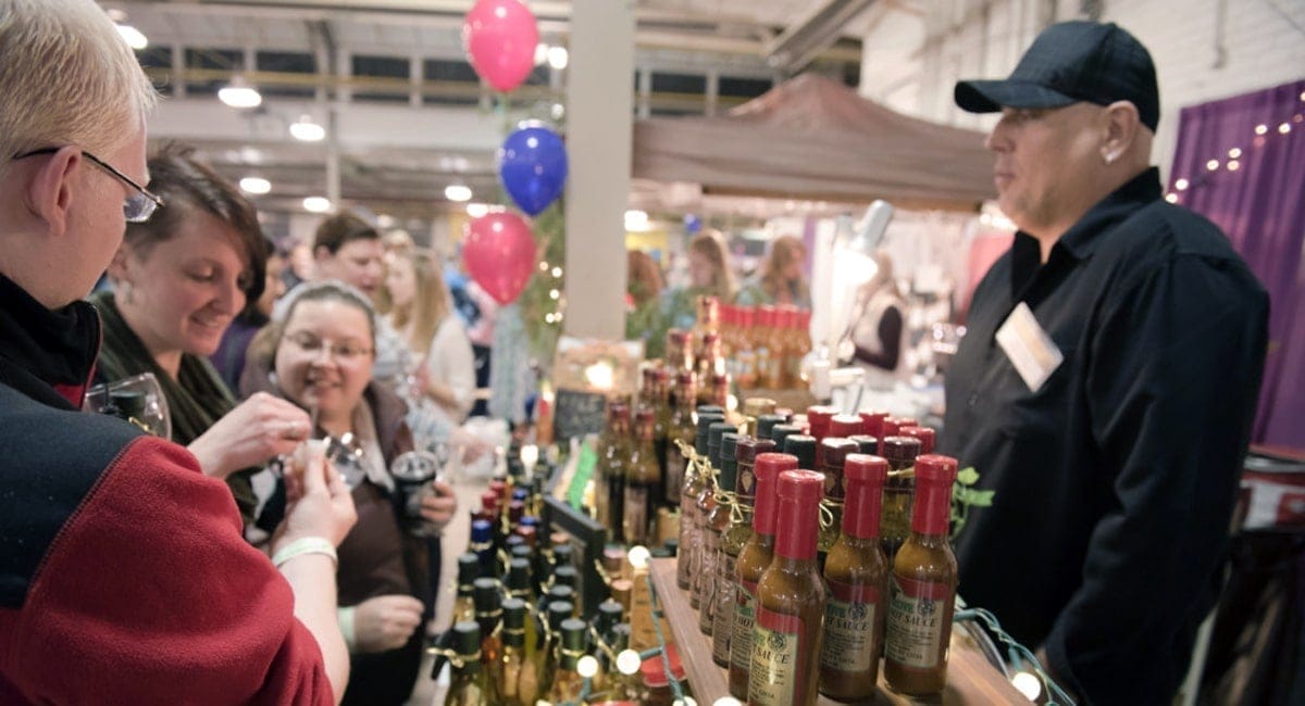 Festival-goers enjoying some savory treats at the Wine & Chocolate Festival in Utica, NY. | Photo from Wine & Chocolate Festival