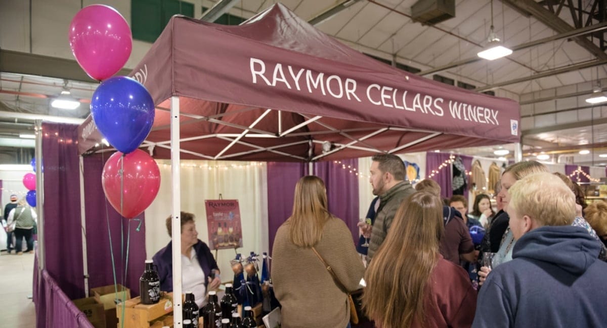 Guests learning about NY wineries at the Wine & Chocolate Festival. | Photo from Wine & Chocolate Festival