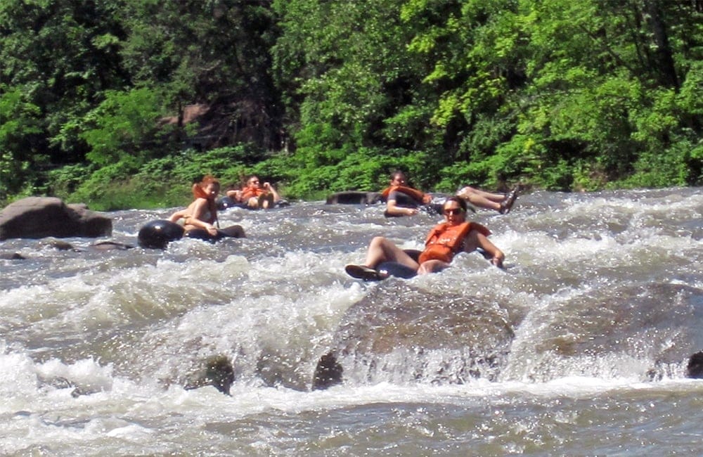 Guests enjoy a thrilling tubing experience at Town Tinker Tube Rentals | Photo from Mike Spille, Wikimedia Commons
