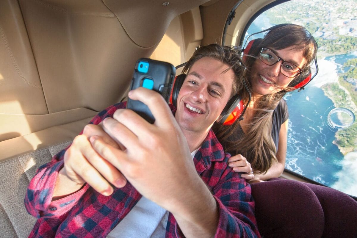 Passengers snap a pic while taking a Rainbow Air Helicopter tour of Niagara Falls