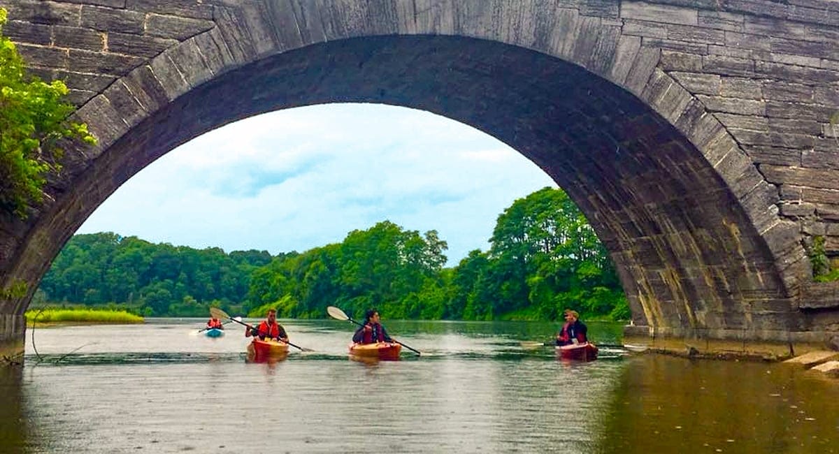 Paddling beneath the aqueduct at Schoharie Creek in Fort Hunter, NY. | Photo by Audrey Egelston