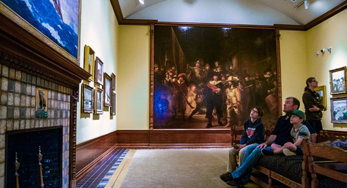 A family admiring the artwork at the Arkell Museum. | Photo by Andrew Frey