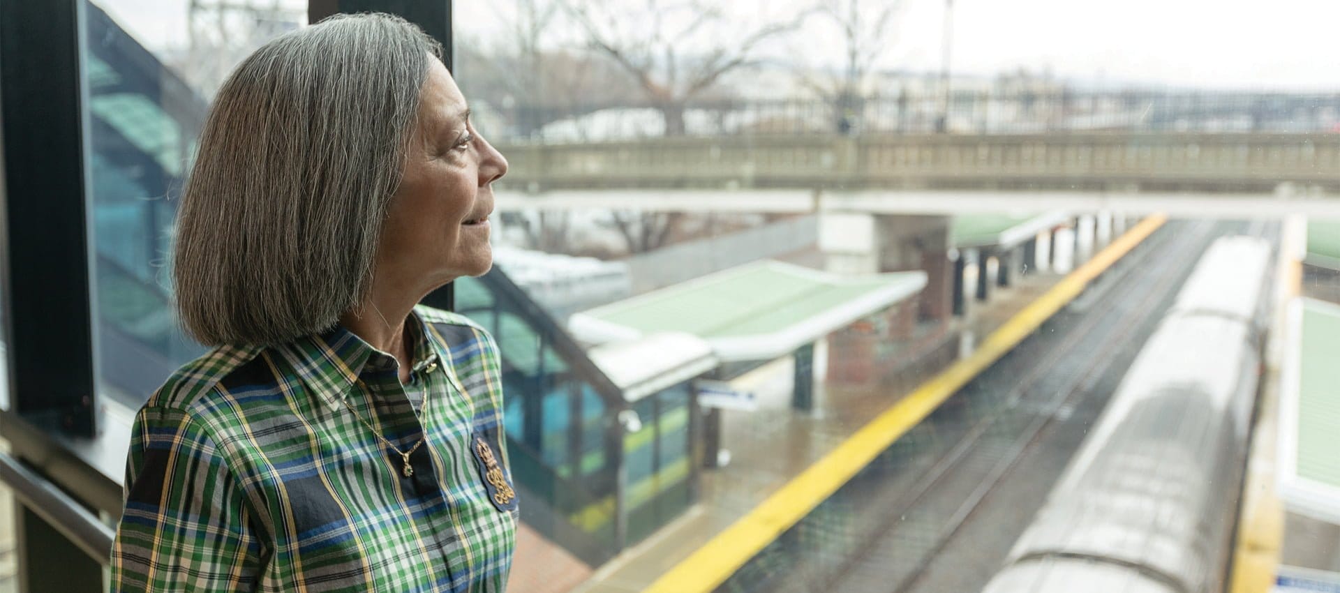 Sandy Nardoci looks out at the Amtrak yard at the Albany-Rensselaer station. Hope in Healing | Voices of Hope | Photo Courtesy of Filmworks 109