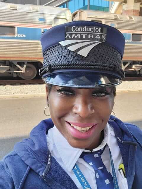 Amtrak conductor Loretta Lacy in front of train
