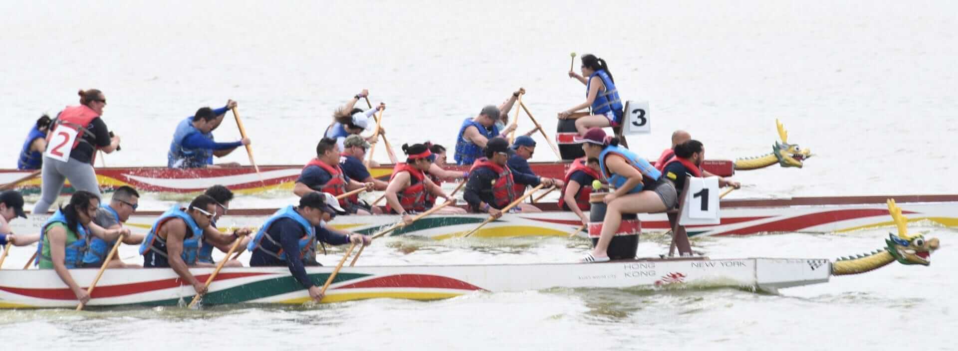Rowers competing at the Hong Kong Dragon Boat Festival in NY