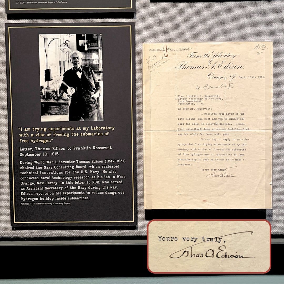 A museum display with a photo of Thomas Edison, a quote about a submarine from his 1918 letter to FDR, the original typed letter with Edison’s signature, and a close-up of the signature, “Yours very truly, Thos A. Edison.”.