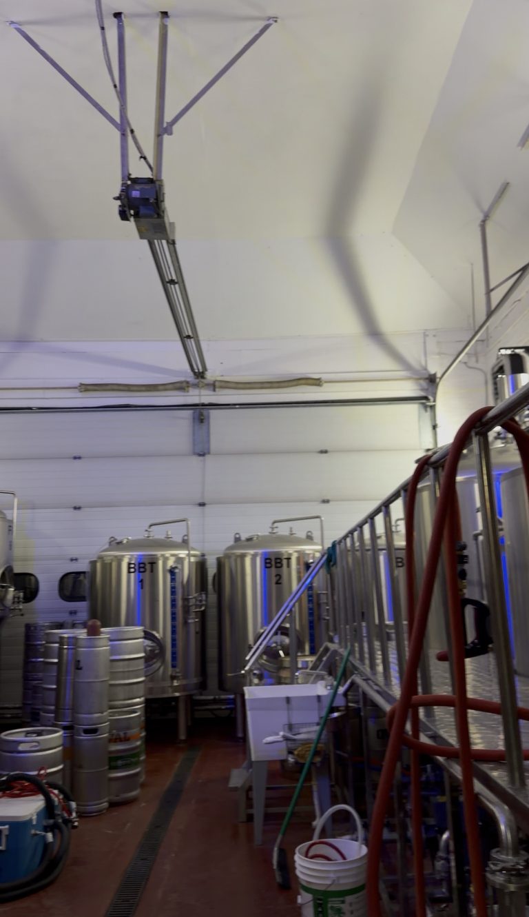 Several large stainless steel tanks and kegs fill this brightly lit brewery, a stop Miss New York Explores Albany NY by Amtrak might enjoy while discovering the city’s vibrant industrial spaces.